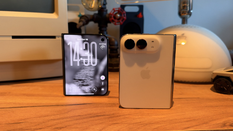 Two iPhone Duos on a table: one with the display facing forwards and one with the rear panel facing forwards