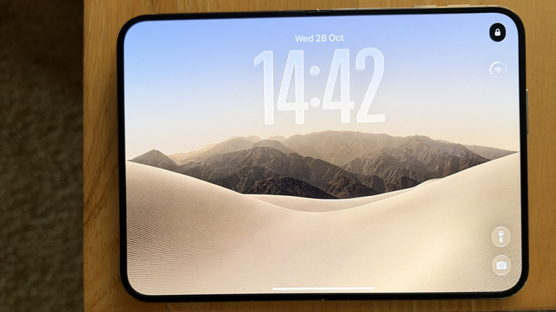 iPhone Duo unfolded on a wood table