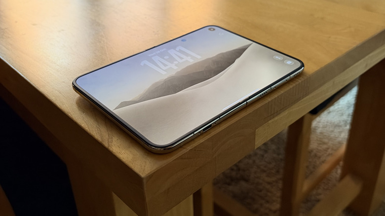iPhone Duo sat unfolded on a wood table, photographed at an angle