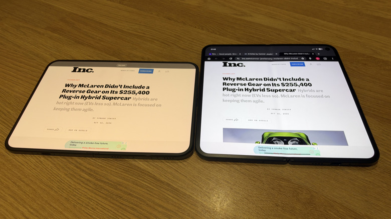 iPhone Duo and Pixel 11 Pro Fold flat on a wood table with a web page open
