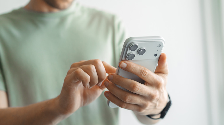 person using iphone