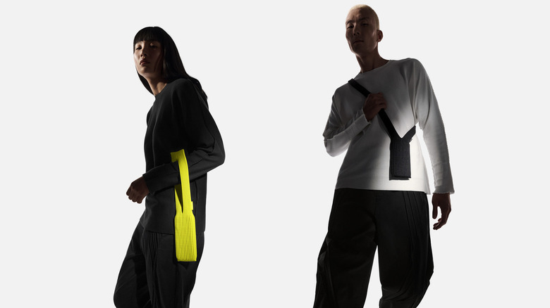 A man and a woman wearing the iPhone pocket