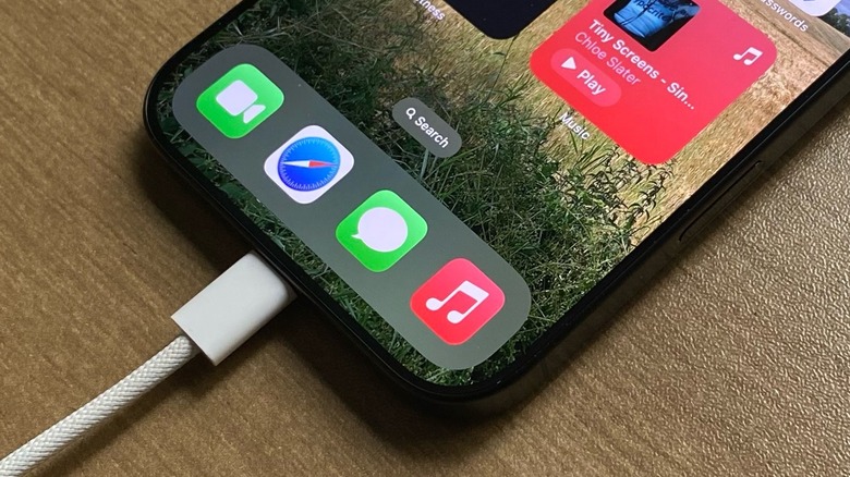 An iPhone charging through its USB-C port