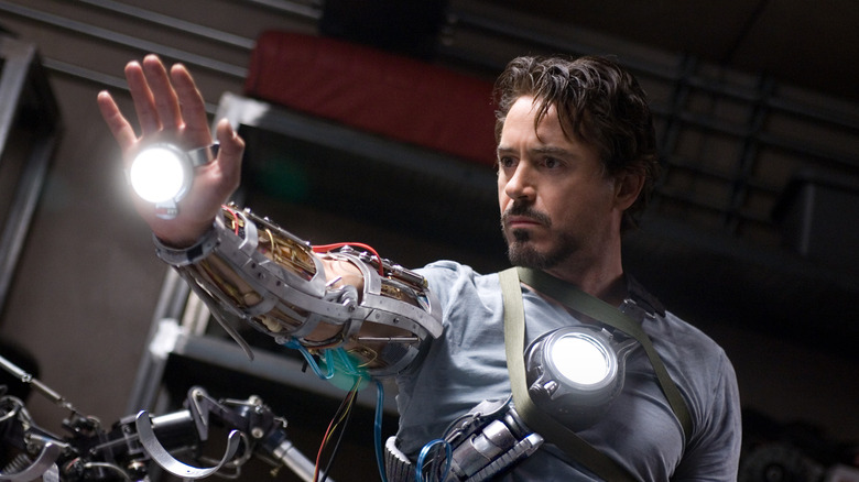 Tony Stark (Robert Downey Jr.) testing new Iron Man suit tech from the film Iron Man (2008).
