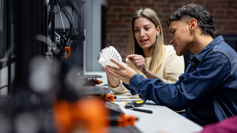 Students examine a 3D printed model
