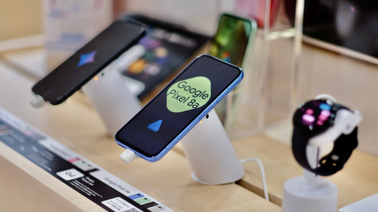 The Google Pixel 8a mobile phone on display at an electronics store