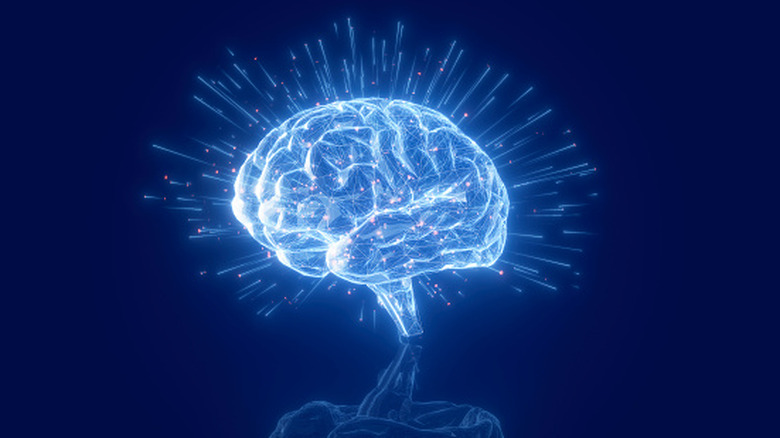 A graphic showing a bright blue brain against a dark background evokes technology's effect on human consciousness.