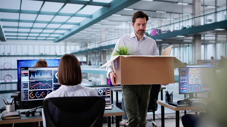 A man packs up after losing his job