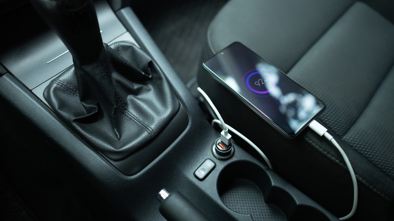 a phone charging inside a car