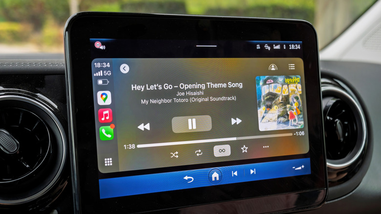 Playing music inside the car with Apple CarPlay.
