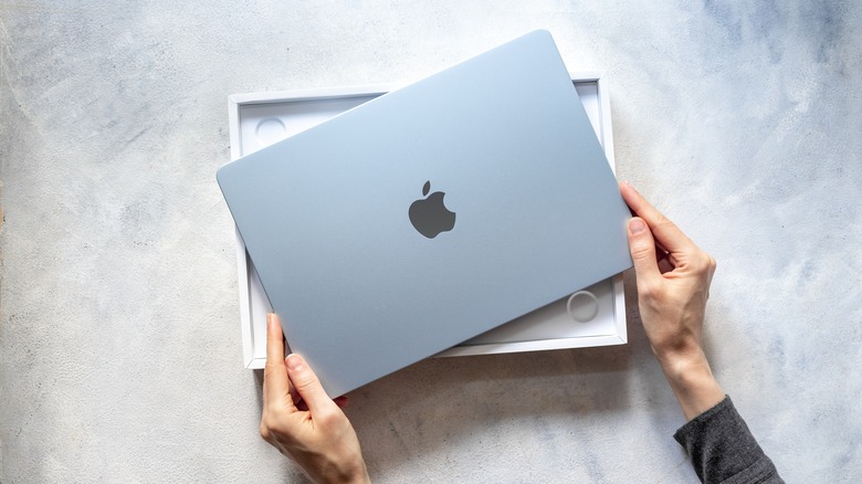 Unpacking a new MacBook Air.