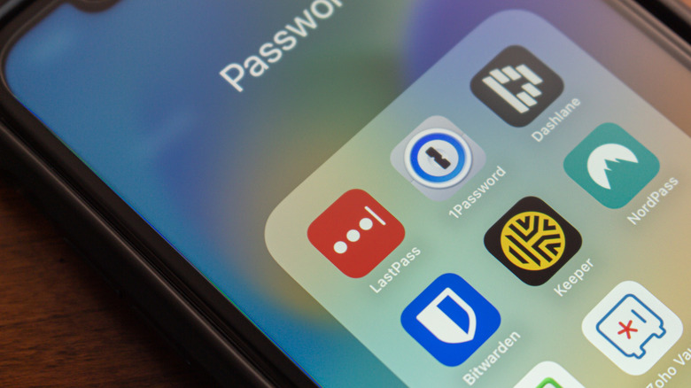 A close-up of password manager apps in a phone's folder