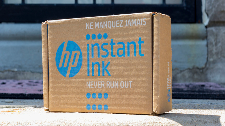 HP instant ink cardboard package on a sidewalk