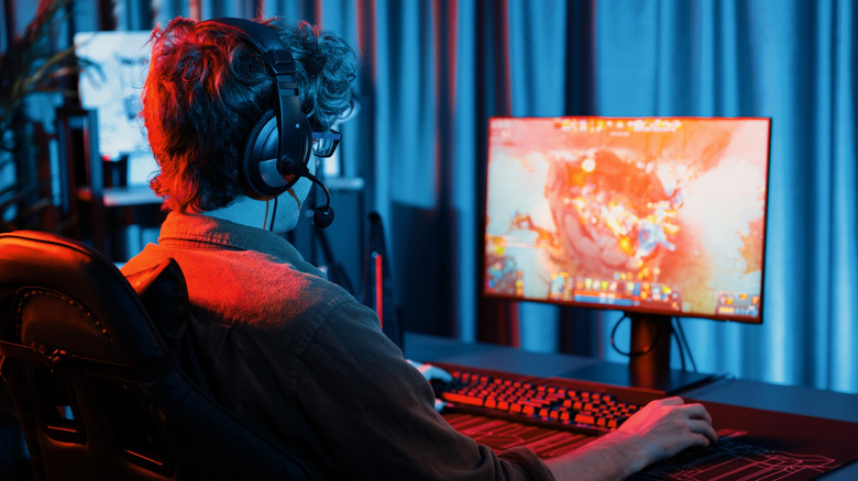 A man playing a PC game