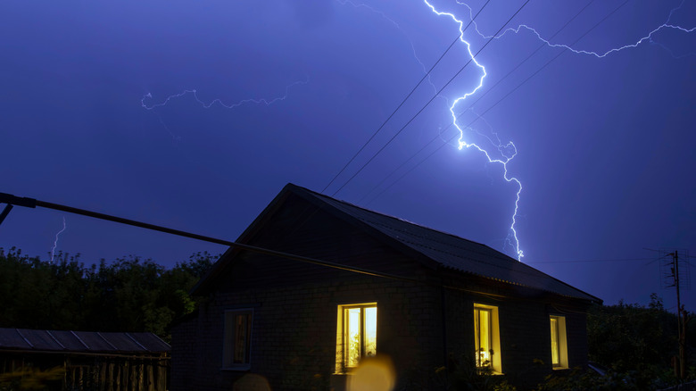 a thunderstorm outside of a house