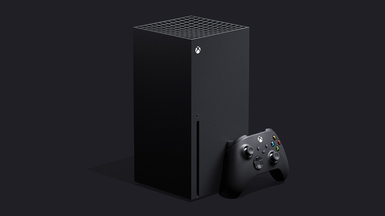 Xbox Series X console and controller against black background