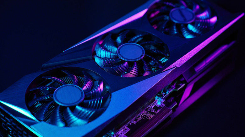 A GPU illuminated with blue and purple lighting.