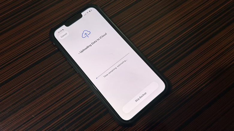An iPhone 13 asking to upload data to iCloud or skip backup