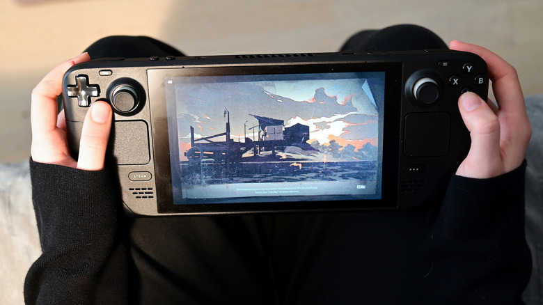 Playing games on the Steam Deck handheld PC.