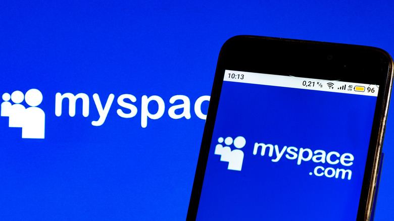 cell phone with the myspace logo and name on a blue backdrop