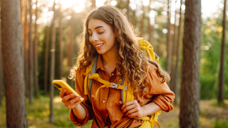 Woman using phone outdoors
