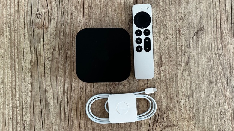 Apple TV 4K, Siri Remote, and USB-C cable on a table