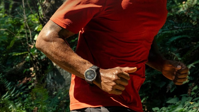 A runner wearing the Amazfit T-Rex 3 smartwatch.