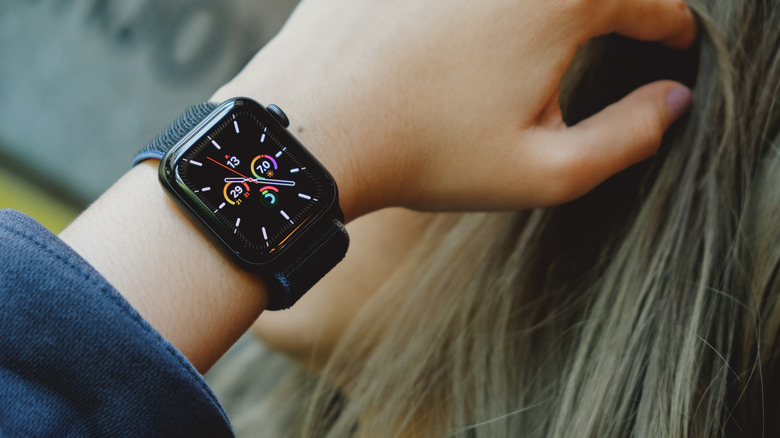 The Apple Watch SE (2020) on hand.