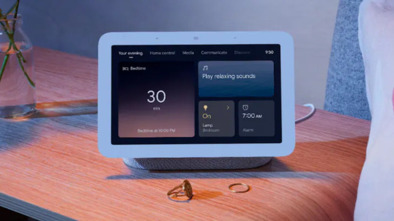A Google Nest Hub (2nd Gen) set up on a bedside table.