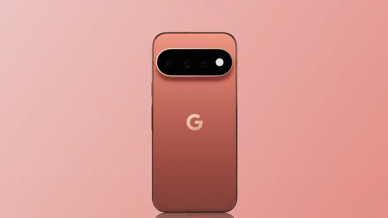 A Google Pixel 11 Pro standing in front of a pink background.