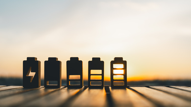 different battery levels shown with wooden blocks against a sunset