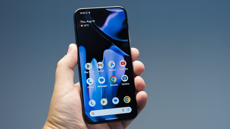 Close-up of a person holding the Google Pixel 9 Android smartphone