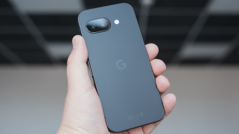 Person holding a Google Pixel 9a smartphone