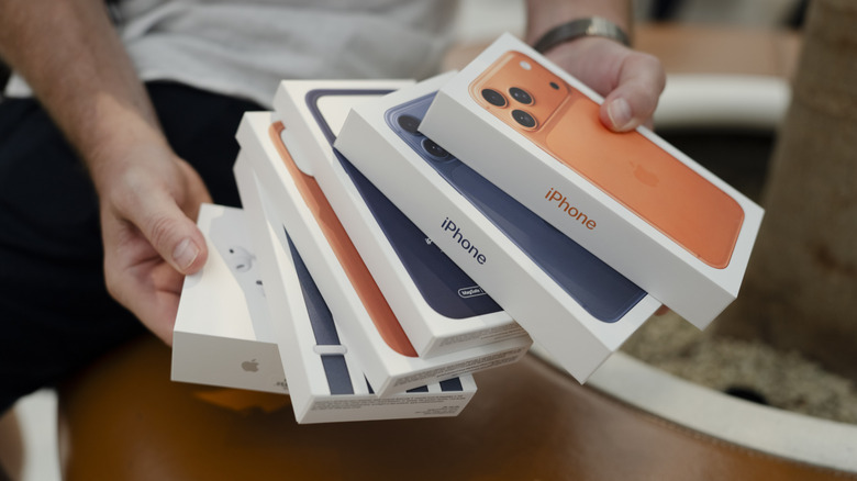iPhone 17 Pro Max in retail boxes and Apple accessories.