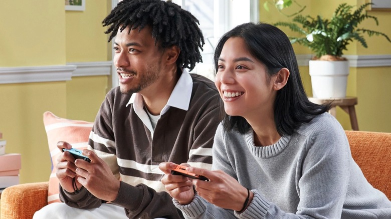 Two people playing Nintendo Switch 2 with single Joy-Con controllers