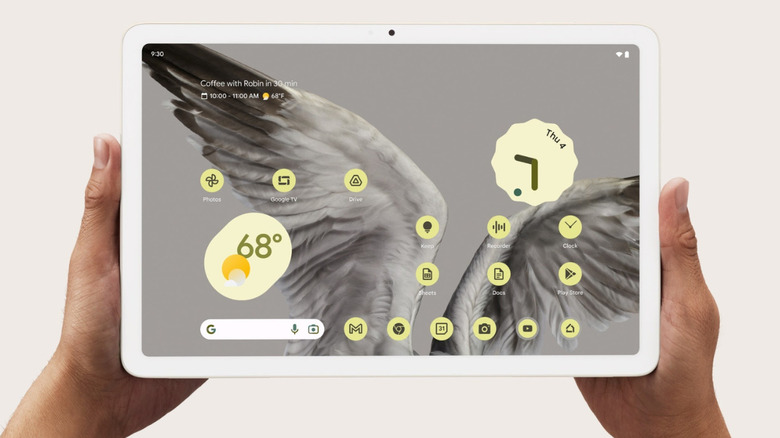 Two hands holding a Google Pixel tablet