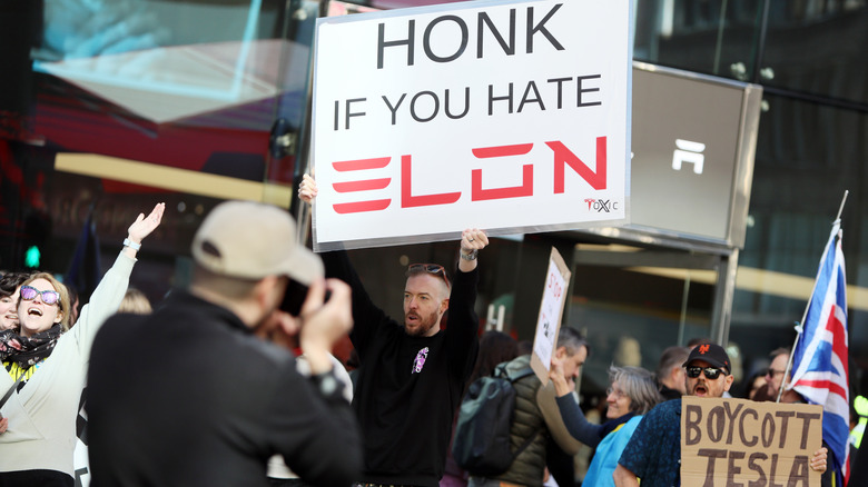 Elon Musk and Tesla protestors
