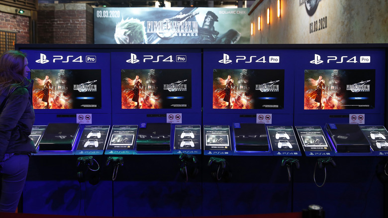 A lineup of PS4 Pro consoles at a promotional event for Final Fantasy 7 Remake