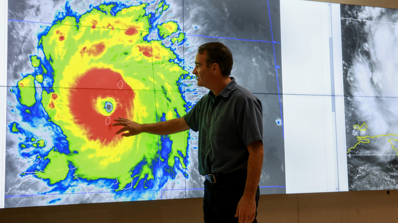 A meteorologist plots a cyclone at NOAA's National Hurricane Center in Miami.