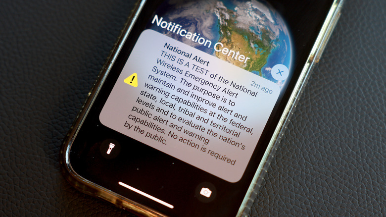 A phone receives a national Wireless Emergency Alert during a test in 2023.