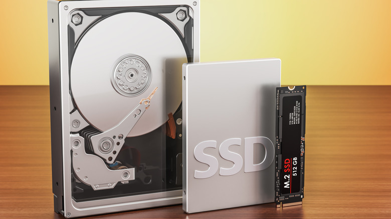 An internal SSD, an external SSD, and a hard disk drive lined up on a table