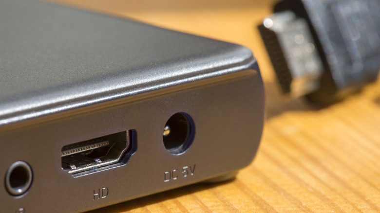Close up of HDMI port in set top box with cable in background.