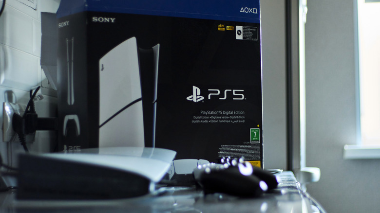 A PS5 gaming console and controller placed on a table