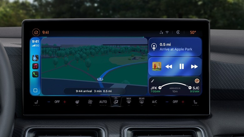 An infotainment system of a car revealing the new iOS 26 CarPlay experience with widgets support.