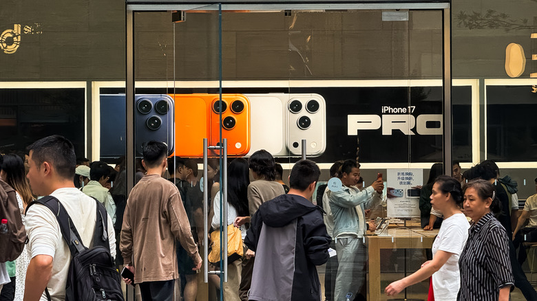 The iPhone 17 on display in a retail store.