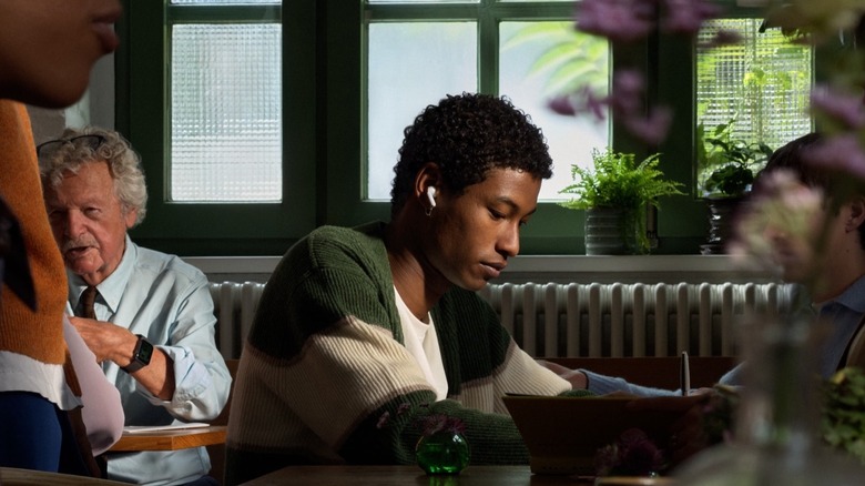 Man using new AirPods 5