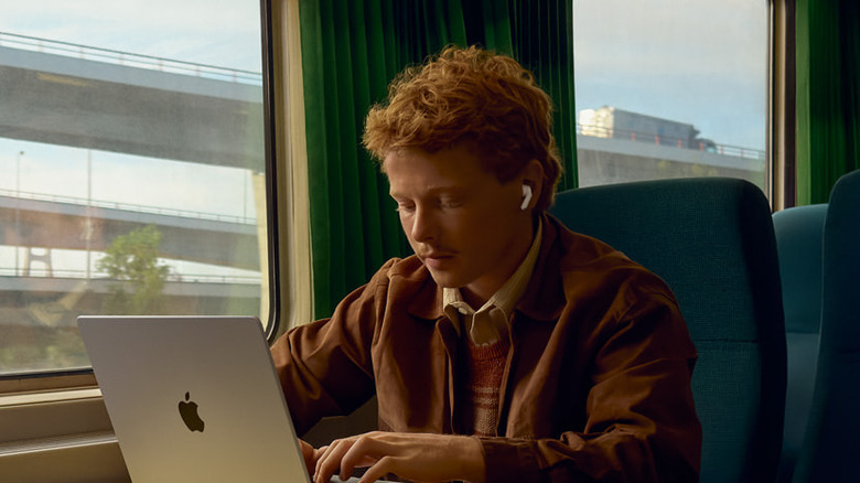 Man using Airpods Pro 3