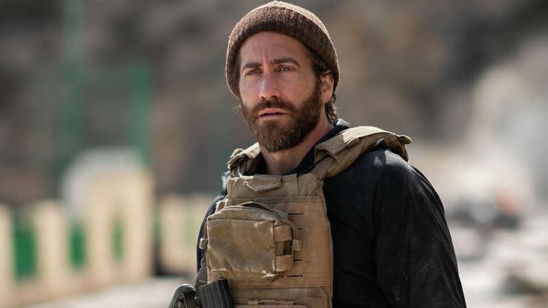 Jake Gyllenhaal wearing a wooly hat in The Covenant