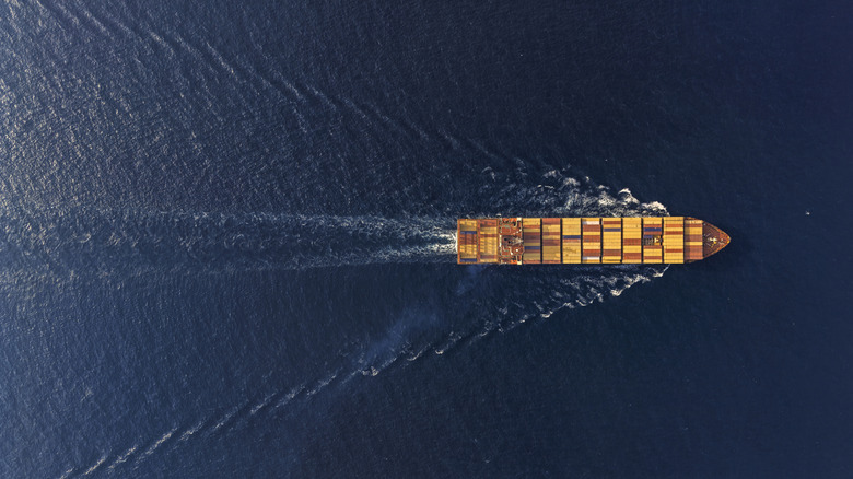 Top down view of a moving cargo ship.