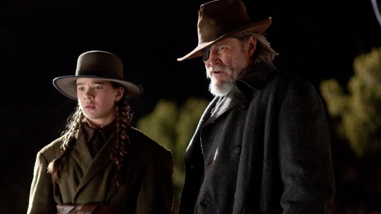 Hailee Steinfeld as Mattie Ross and Jeff Bridges as Rooster Cogburn in True Grit